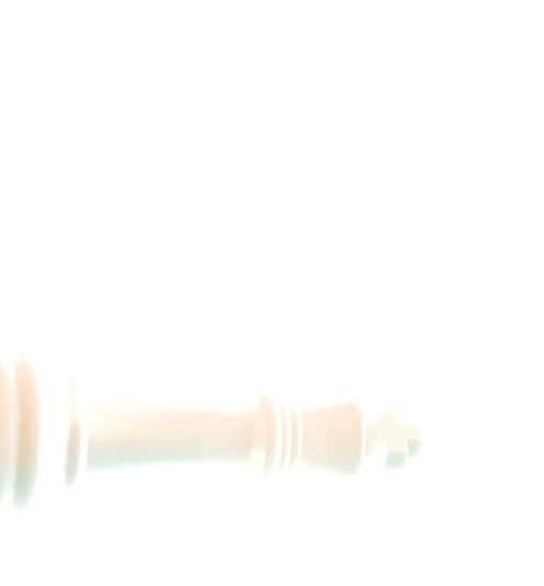 White chess king piece lying on its side